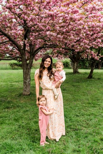 Mother Holding Baby with Toddler all in Pink